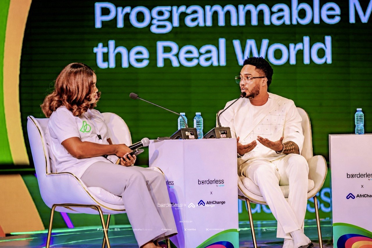 Harrison speaking with attendees at a Web3 event